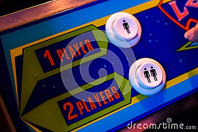 Select One Player or Two Players Button. Detail of an old arcade video game Editorial Stock Photo