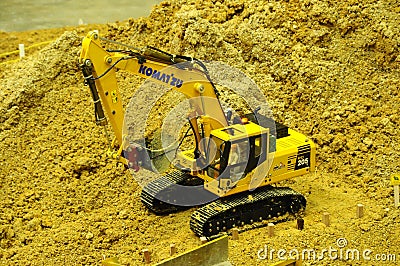 Selected focused on remote control construction machinery toys. Editorial Stock Photo