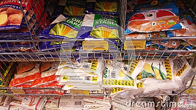 Selected focused on wheat flour of various brands sold in commercial packaging. Editorial Stock Photo