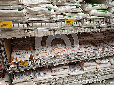 Selected focused on wheat flour of various brands sold in commercial packaging. Editorial Stock Photo