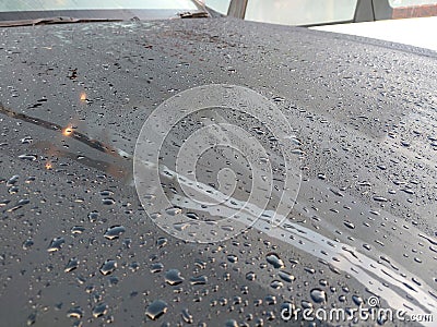 Selected focusing on raindrops and dew on black metal surfaces. Stock Photo