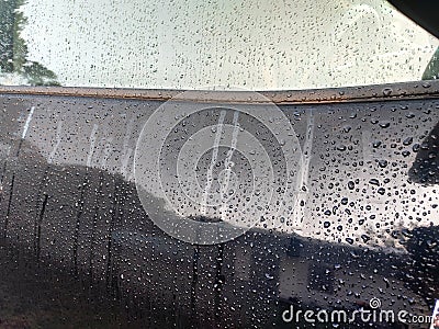Selected focusing on raindrops and dew on black metal surfaces. Stock Photo