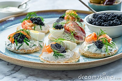 Selection of cocktail blinis - gourmet party food Stock Photo