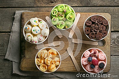 Selection of different rolled ice creams in cone cups Stock Photo