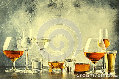 Selection of hard strong alcoholic drinks in big glasses and small shot glass in assortent: vodka, cognac, tequila, brandy and Stock Photo