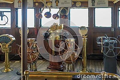 Selection of old copper and brass ships wheels Stock Photo