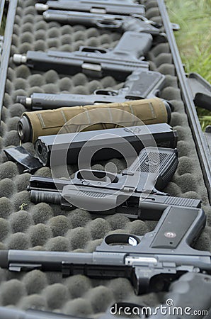 Selection of pistol firearms at the target practice range Editorial Stock Photo