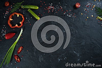 Selection of spices herbs and greens. Ingredients for cooking. Food background on black slate table. Stock Photo