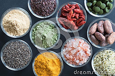 Selection of superfoods on a black background Stock Photo