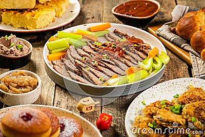 Selection of traditional hanukkah food for festive dinner, wood background Stock Photo