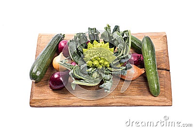 Selection of vegetables on a wooden board Stock Photo