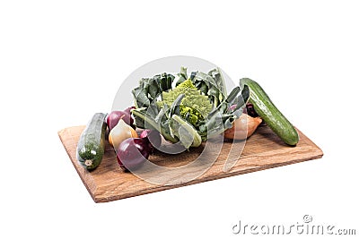 Selection of vegetables on a wooden board Stock Photo