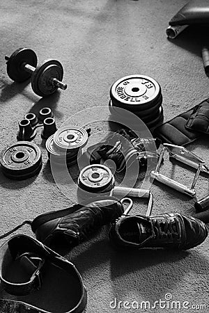 Assorted weight-training Equipment Including Round Weights. Editorial Stock Photo