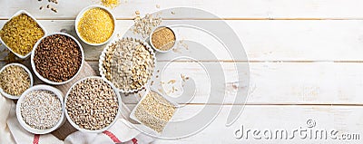 Selection of whole grains in white bowls - rice, oats, buckwheat, bulgur, porridge, barley, quinoa, amaranth, Stock Photo