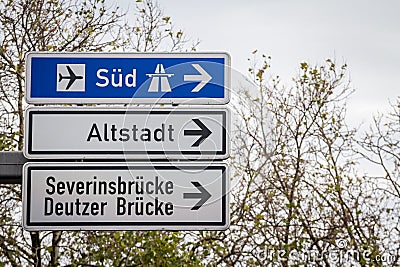 Selective blur on german roadsign in Cologne, Germany, directing to autobahn motorway heading south (Sud in German) & local road Stock Photo