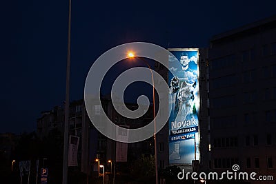 Selective blur on a poster promoting Novak Djokovic in the streets of Belgrade at night. Editorial Stock Photo