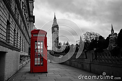 Selective color red telephone box in London Editorial Stock Photo