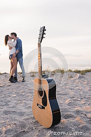 Selective focus of acoustic guitar on Stock Photo