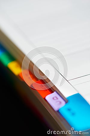 Closeup of alphabetical index of address book background blur image Stock Photo