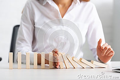 Selective focus of businesswoman holding falling Stock Photo