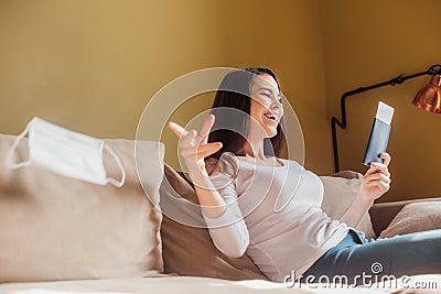 Selective focus of cheerful woman throwing Stock Photo