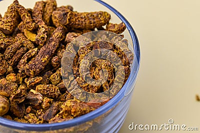 Selective focus closeup of a glass of dried carnation spices Stock Photo