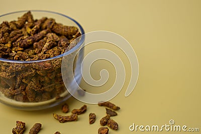 Selective focus closeup of a glass of dried carnation spices Stock Photo