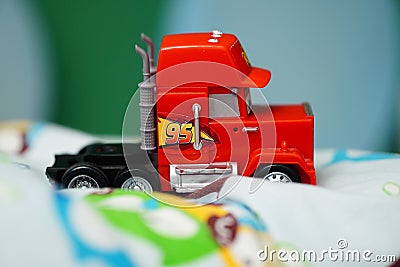 Selective focus closeup of a toy model Mack truck from the Disney Pixar Cars series. Editorial Stock Photo