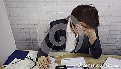 Selective focus of Confused frustrated Businessman with glasses debt notification as bad financial report and money Stock Photo