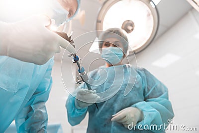 Selective focus of cystourethroscope in the hands of doctors Stock Photo