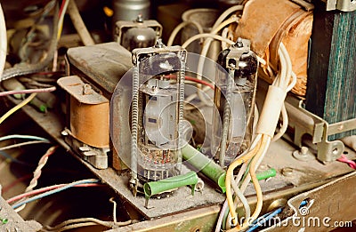 Selective focus on dusty vintage tube inside retro radio station. Stock Photo