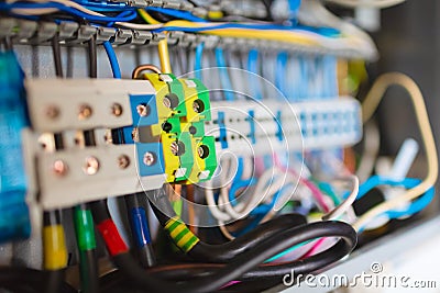 Selective focus of electrical wires is connected to cuprum clamps in box of distribution of an electricity in the Stock Photo