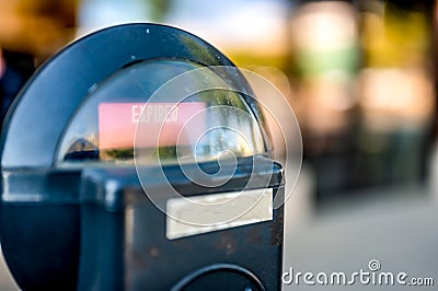 Selective focus on an expired parking meter with no time left. Stock Photo