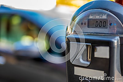 Selective focus on an expired parking meter with no time left. Stock Photo