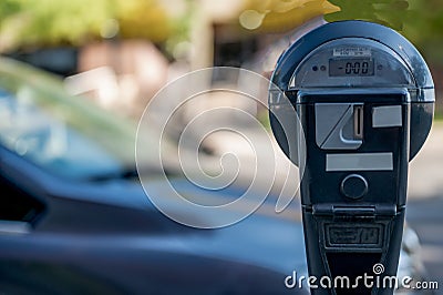 Selective focus on an expired parking meter with no time left. Stock Photo