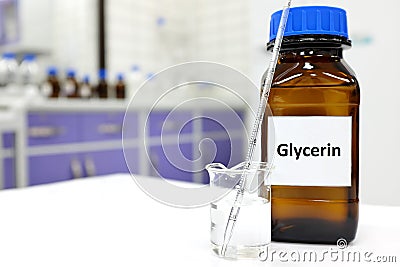 Selective focus of glycerin glass bottle in a white laboratory background with copy space. Stock Photo