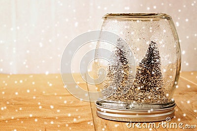 Selective focus image of christmas trees in mason jar. glitter overlay Stock Photo