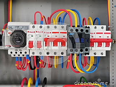 Selective focus image with noise effect a row of electrical parts mount on distribution board. Editorial Stock Photo