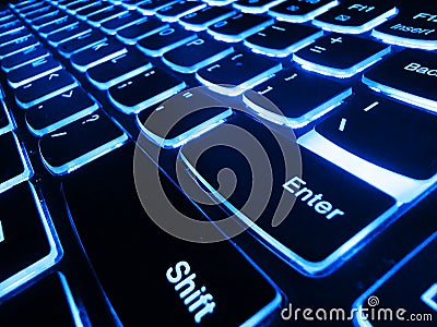 Selective Focus. The keyboard of a computer. Illuminated keyboard. Computer keyboard with glowing charts, digital marketing Stock Photo