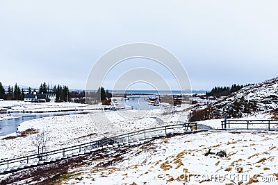 Selective focus - Landscape in Iceland with houses, mountains, rivers, sea, trees and snow Stock Photo