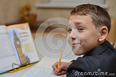 Selective focus of little boy learning how to write his name, Kid study at home, Children do homework at home, Concept for toddler Stock Photo