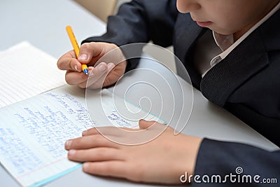 Selective focus of little boy learning how to write his name, Kid study at home, Children do homework at home, Concept for toddler Stock Photo