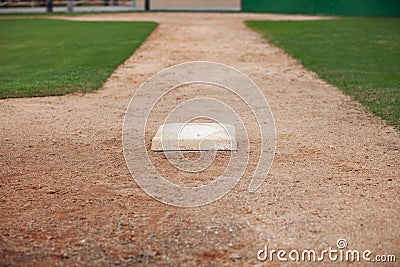 Selective focus low angle view of a baseball infield looking toward home from third base Stock Photo