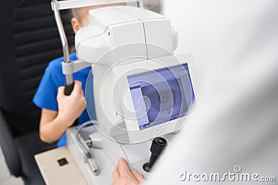 Selective focus of machine for checking eyesight in clinic Stock Photo