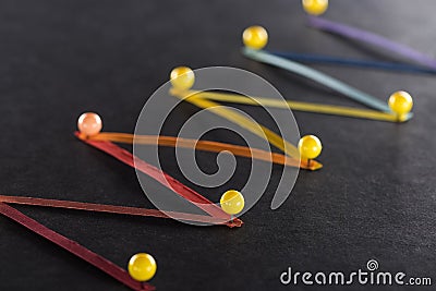 Selective focus of multicolored abstract connected lines with pins on black background, connection and communication Stock Photo
