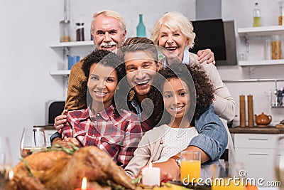 Focus of multicultural family looking at Stock Photo