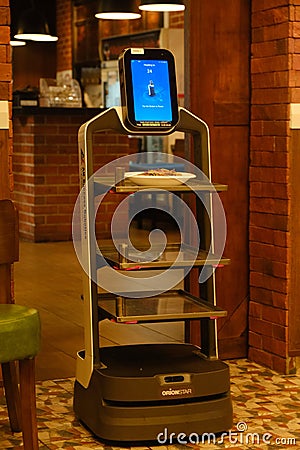 Moving robot serving food Editorial Stock Photo