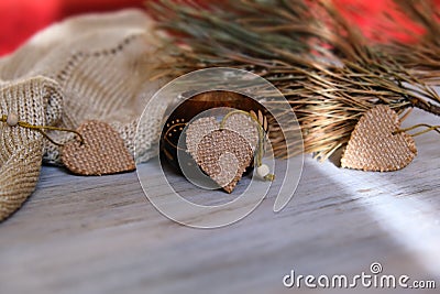 Selective focus and partial blur of decorative hearts with warm plaid, shadow and sunlight, interior details of authentic home Stock Photo