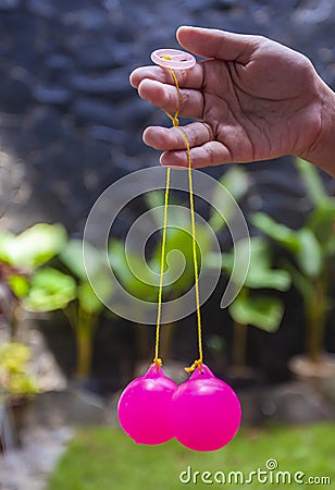 Selective focus photo of Lato-Lato, a traditional children`s toy which is currently going viral, especially in Indonesia. Stock Photo