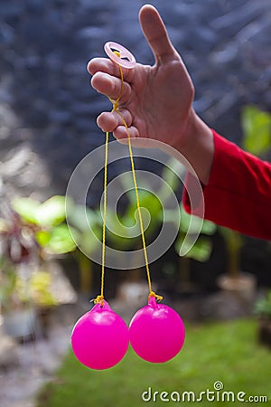 Selective focus photo of Lato-Lato, a traditional children`s toy which is currently going viral, especially in Indonesia. Stock Photo